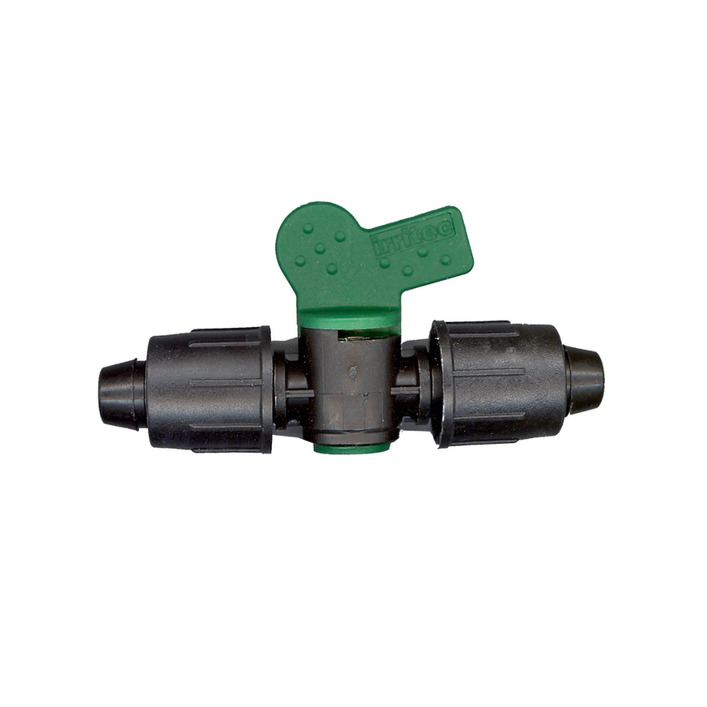 Black drip irrigation valve with a green handle for controlling water flow.